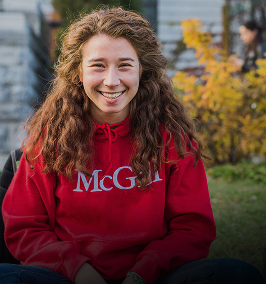 Student with a red McGill hoodie smiling